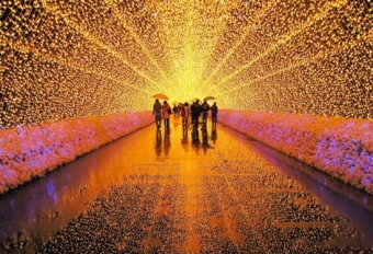 People walking through lighted tunnel.
